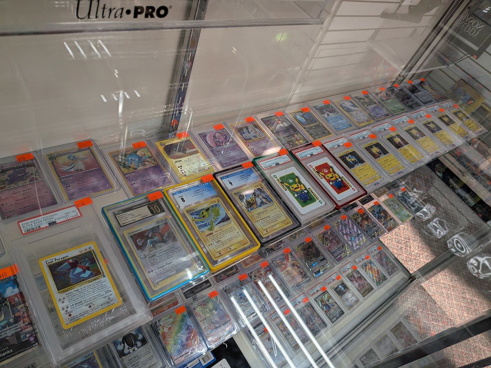 Graded Pokémon cards in the Jams3 display case