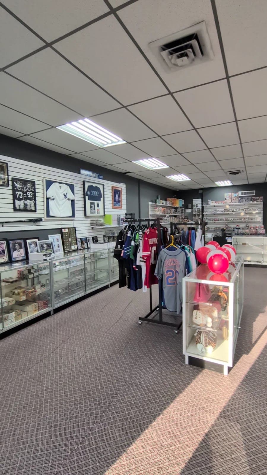 Jerseys and display cases inside the shop